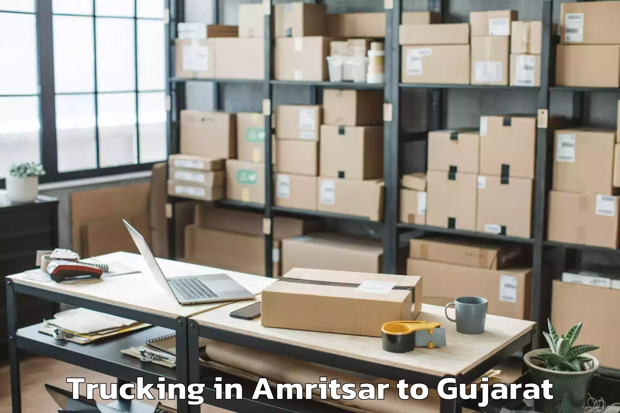 Book Amritsar to Crystal Mall Rajkot Trucking Online